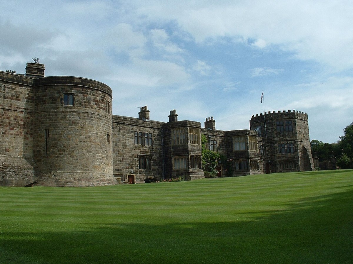 The stone walls and rounded towers of Skipton Castle